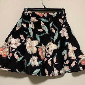 Two piece top and skirt. Nice material. Color: black with floral design.